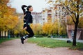 Woman feet jumping, using skipping rope in park. Royalty Free Stock Photo