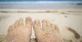 Woman feet on the sand of the beach with the sea water i Royalty Free Stock Photo
