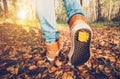 Woman Feet sneakers walking on fall leaves Outdoor Royalty Free Stock Photo