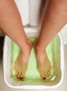 Woman feet in spa bowl