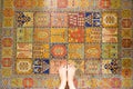 Woman Feet Standing on Vintage Carpet