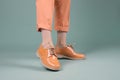 Woman feet stylish orange shoes. Generate Ai