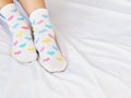 Woman feet wearing white sock with pastel heart shape pattern Royalty Free Stock Photo