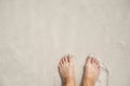 Woman feet on white sand beach. Relaxed barefoot tourist by sea. Seaside banner template with text place.