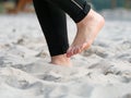 Woman feets are running in white sand of playground Royalty Free Stock Photo