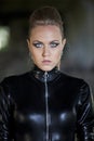 Woman in fetish leather catsuit