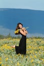 Woman in field of flowers Royalty Free Stock Photo