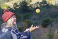 woman in the field throwing an apple in the air Royalty Free Stock Photo