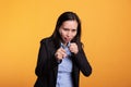 Woman fighter clenching fists to punch in front of camera Royalty Free Stock Photo