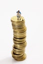 Woman figurine cleaning stack of coins