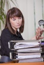 Woman filing her fingernails by work Royalty Free Stock Photo