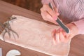 Woman filings nails nail file. Close-up hands. Tools on the table. Royalty Free Stock Photo