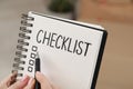 Woman filling Checklist with pen, closeup view Royalty Free Stock Photo