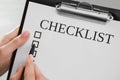 Woman filling Checklist with pen, closeup view Royalty Free Stock Photo