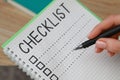Woman filling Checklist with pen, closeup view Royalty Free Stock Photo
