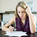 Woman filling in financial documents Royalty Free Stock Photo