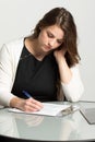 Woman filling out a job application. Royalty Free Stock Photo