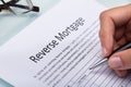 Woman Filling Reverse Mortgage Form