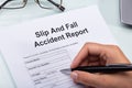 Woman Filling Slip And Fall Accident Report