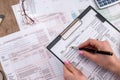 Woman filling tax forms Royalty Free Stock Photo