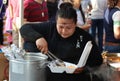 Woman Fills Carry Out Box at Mexican Street Festival in Chicago