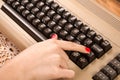 Woman finger press button on old computer keyboard Royalty Free Stock Photo