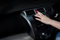 Woman finger pressing car emergency light button in car Royalty Free Stock Photo