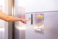 Woman finger pressing the elevator button,Modern lift panel