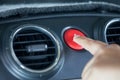 Woman finger pressing emergency button on car dashboard Royalty Free Stock Photo