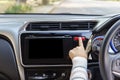 Woman finger pressing emergency button on car dashboard. Royalty Free Stock Photo