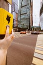 Yellow pedestrian push button and a crossroad