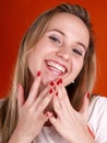 Woman with fingers over her face Royalty Free Stock Photo