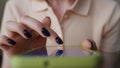 Woman fingers touching touchscreen on smartphone close up. Girl dialing number.