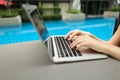 Close up woman fingers pressing keyboard on laptop sunny day swi Royalty Free Stock Photo