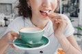 Woman finished her coffee and going to chew gum to clean her teeth from plaque and freshen her breath. Dental health concept