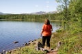 Woman fishing by a lake Royalty Free Stock Photo