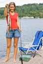 Woman fishing on pier