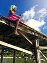 Woman Fishing on a Pier