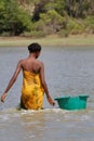 A woman fishing in the river