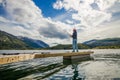 Woman fishing on Fishing rod spinning in Norway Royalty Free Stock Photo