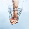 Woman fist through the water Royalty Free Stock Photo