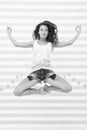 Woman fit slim lady posing as meditating while jump mid air. Healthy lifestyle keep you in good mood. Lady fit healthy