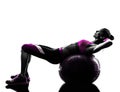 Woman fitness ball crunches exercises silhouette Royalty Free Stock Photo