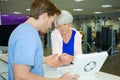 Woman at fitness-center reception with injured wrist