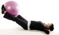 Woman fitness exercise leg raise training ball