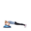 Woman, fitness and half ball for plank in studio for training, strong exercise and gym with muscle health on floor