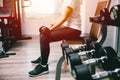 Woman in fitness lifting dumbbell for arm muscle weight training Royalty Free Stock Photo