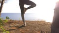 Woman fitness runner on top happy and celebrating success. the woman enjoys the view of the sea from the mountain, she Royalty Free Stock Photo