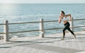 Woman, fitness and running by beach on mockup for exercise, workout or cardio routine. Active female runner in fast Royalty Free Stock Photo