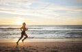 Woman, fitness and running on the beach in sunset for healthy cardio exercise, training or workout on mockup. Female Royalty Free Stock Photo